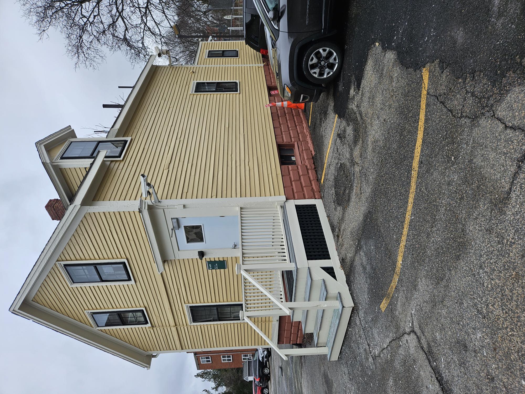 Photo of yellow building on Mellen St