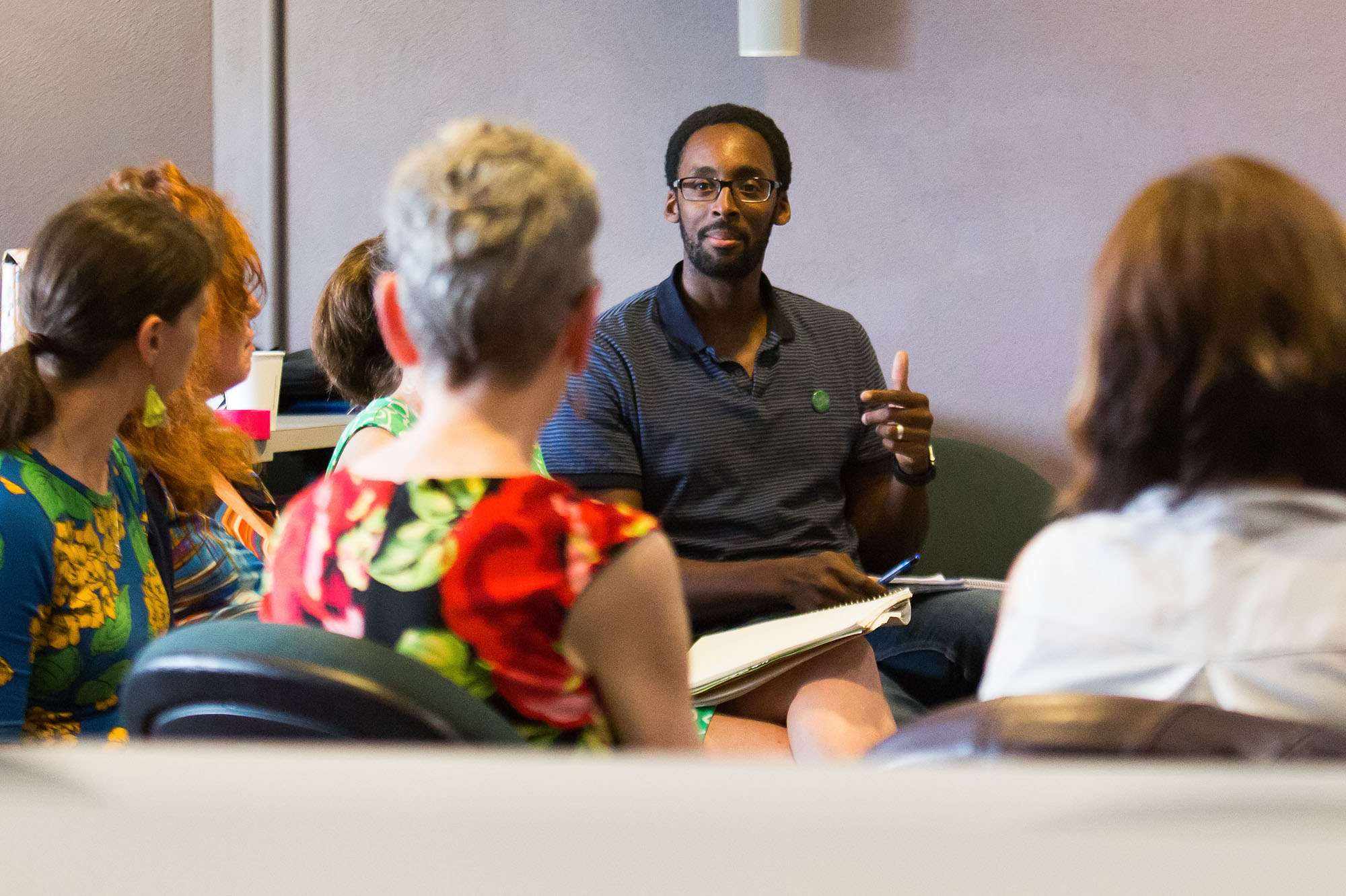 Counseling and Psychology PhD Alum in a Classroom with Peers