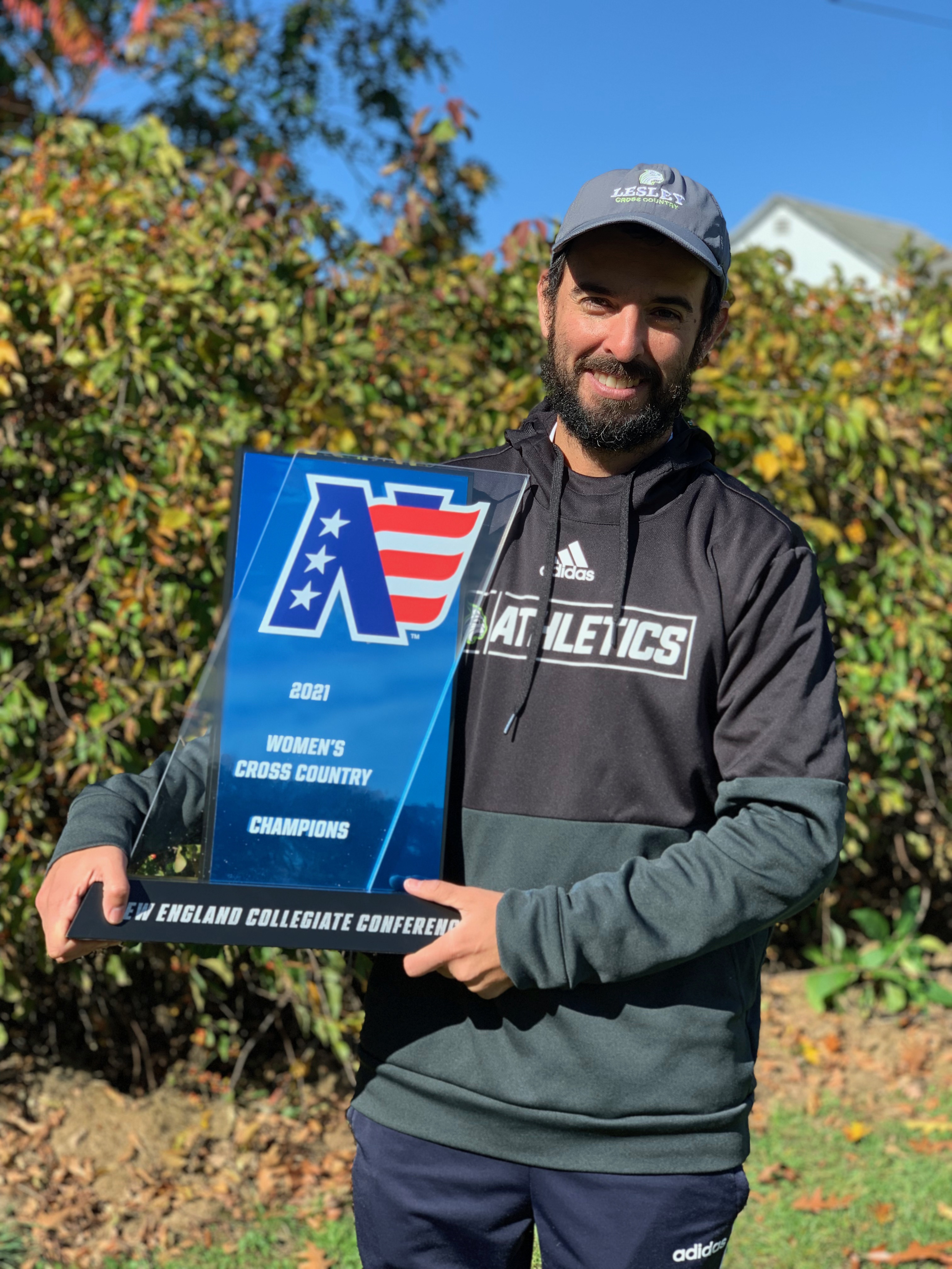 Coach holds NECC trophy