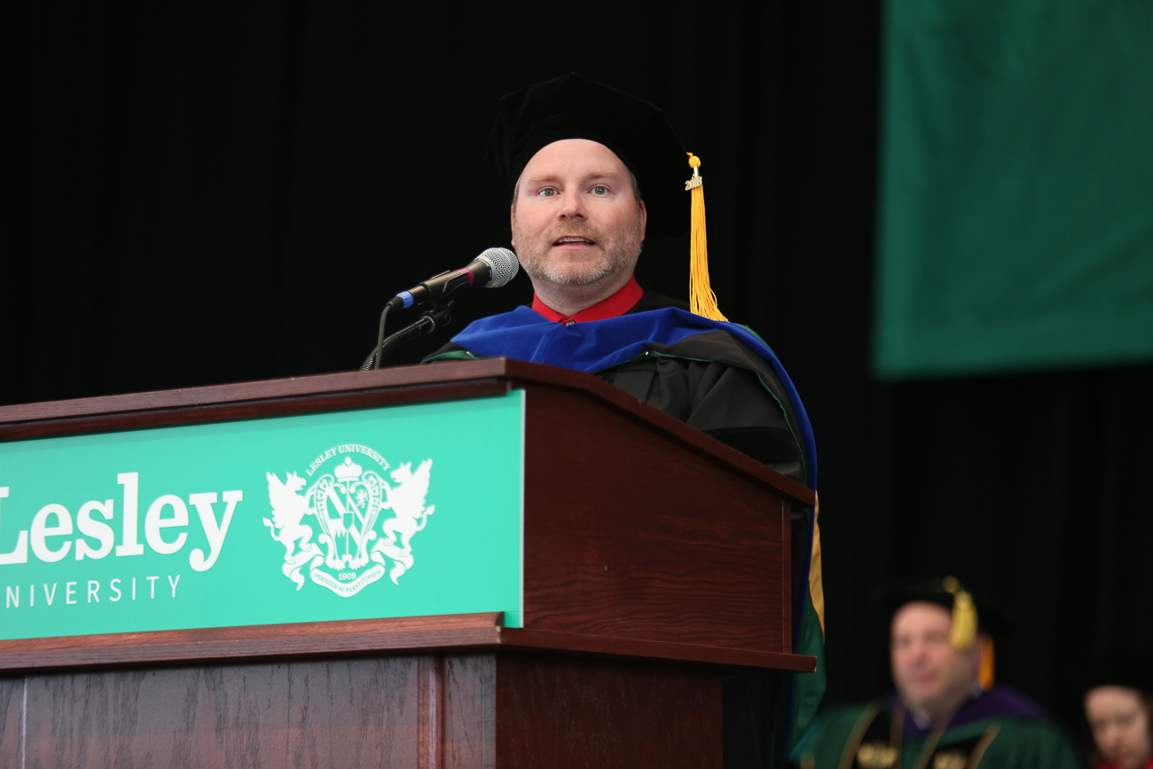 Commencement student speaker Christopher Strickland stands at the podium.