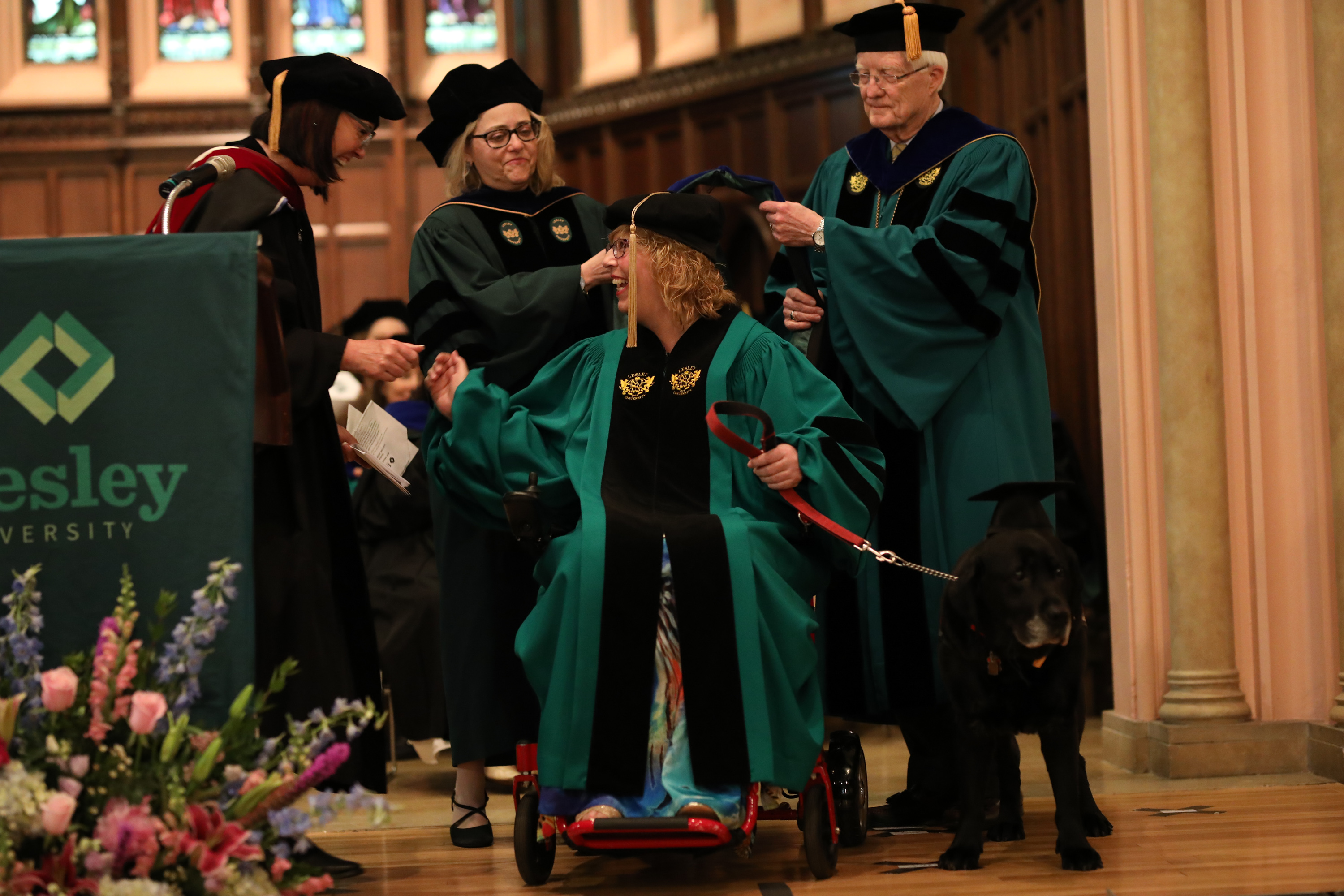 Dee Genetti at PhD hooding ceremony, receiving her hood.