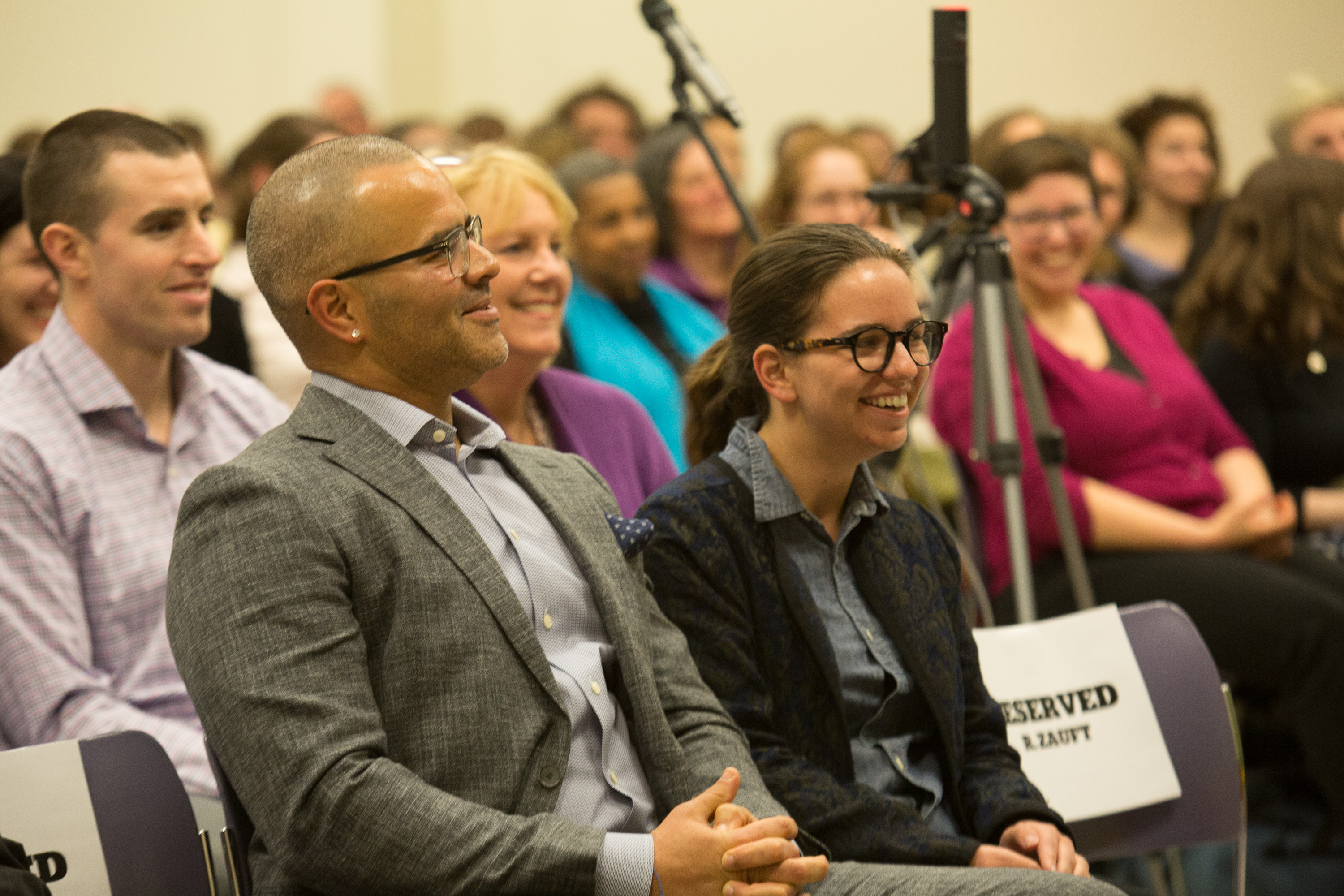 Student Nicole Mello sits next to Christopher Jackson.