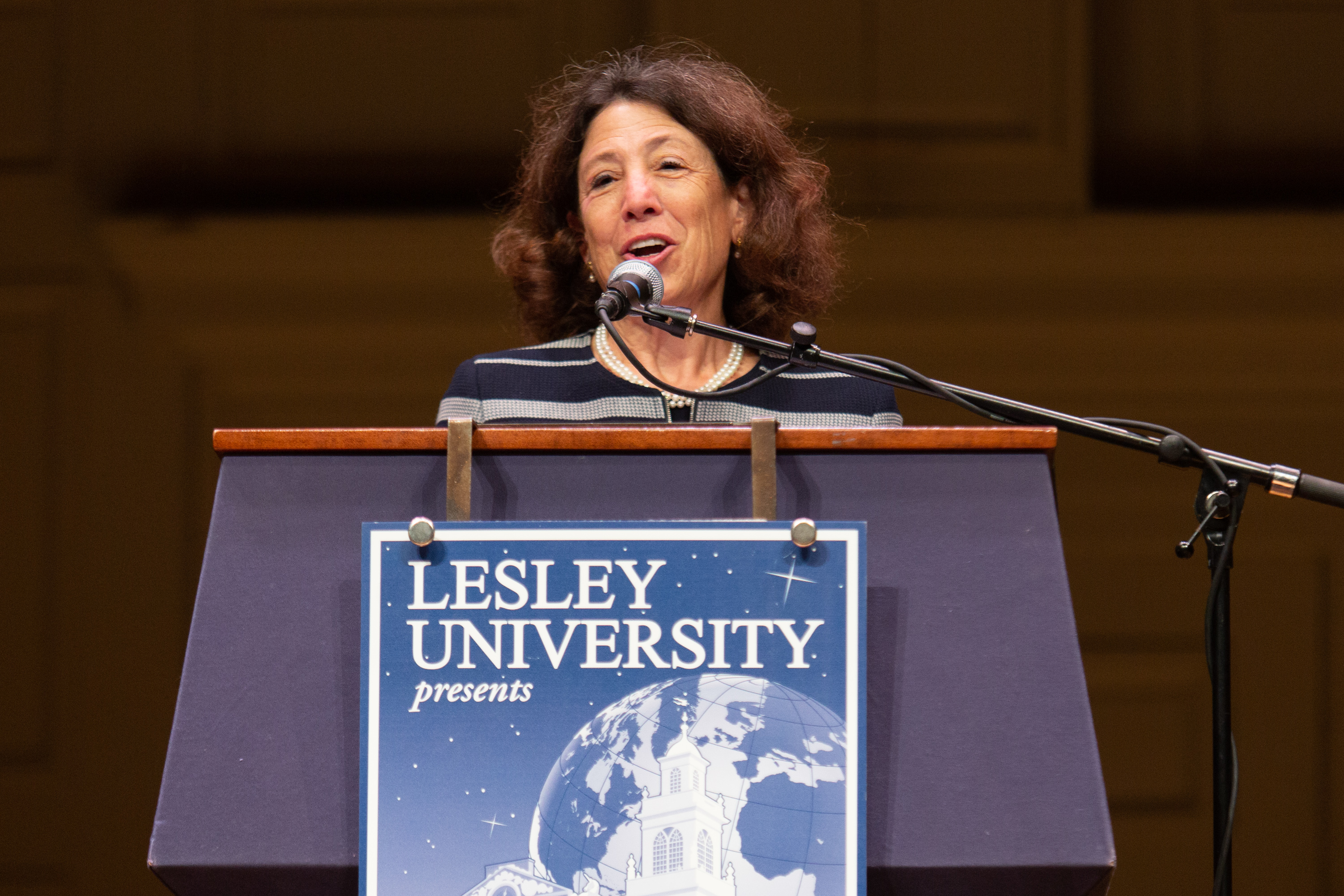 Janet Steinmayer speaks behind a podium