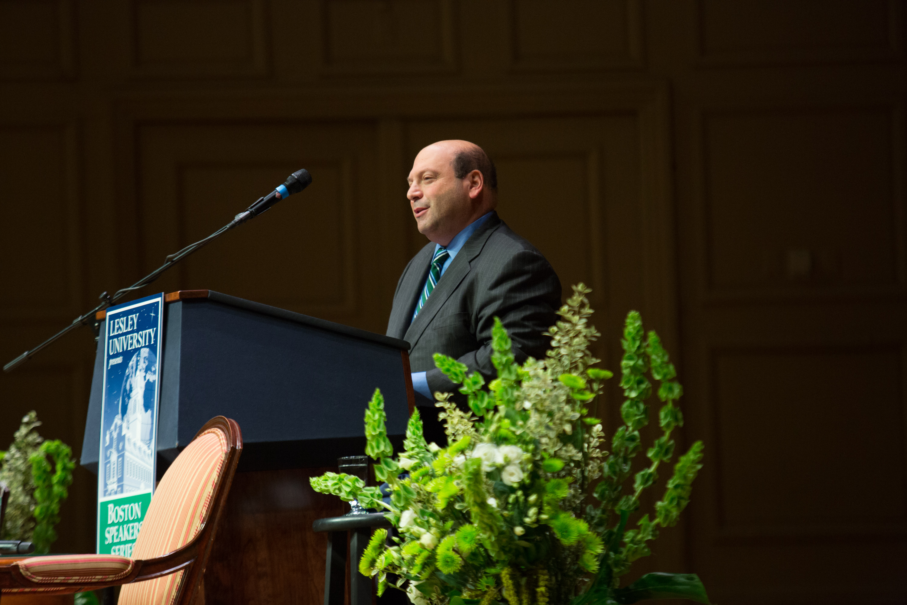 Jeff Weiss standing on stage at the podium