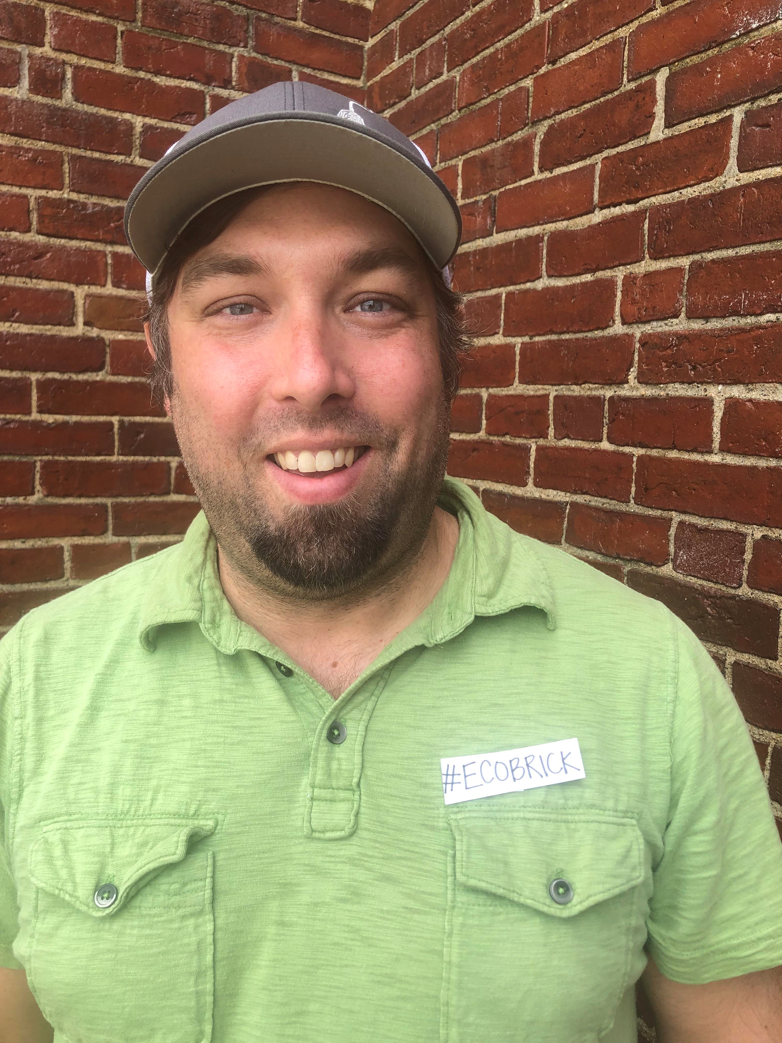 Kevin Heinold headshot wearing a lime green shirt.