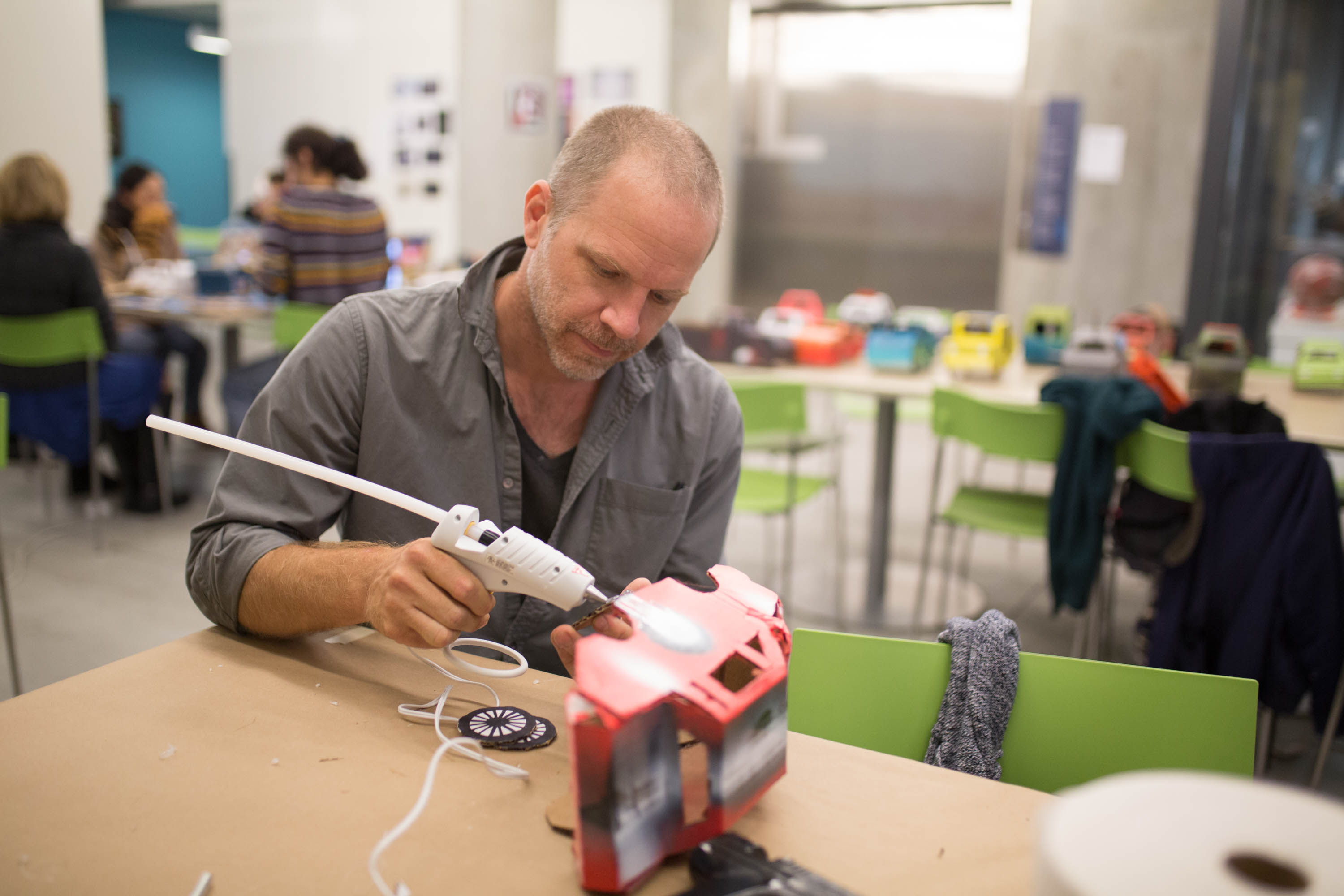 Kiel Johnson works on a vehicle for the collaobrative project. 