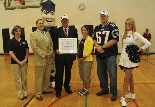 Kirsten Green at a promotional event with Coach Bill Belichick