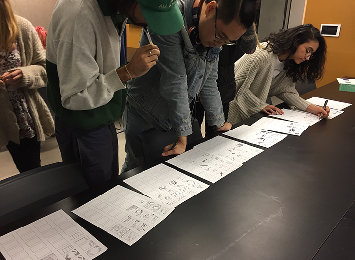 Students work on prototype designs for the Lesley flag