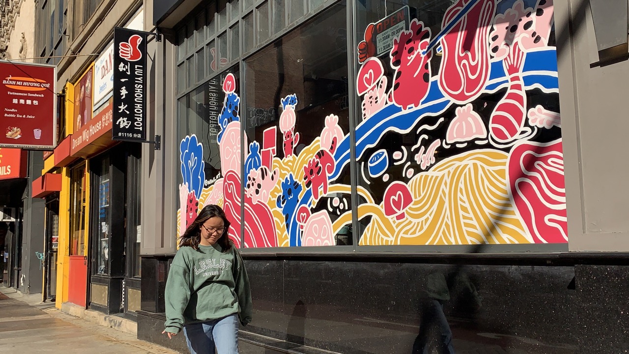 Nell Valle in front of her mural in Chinatown