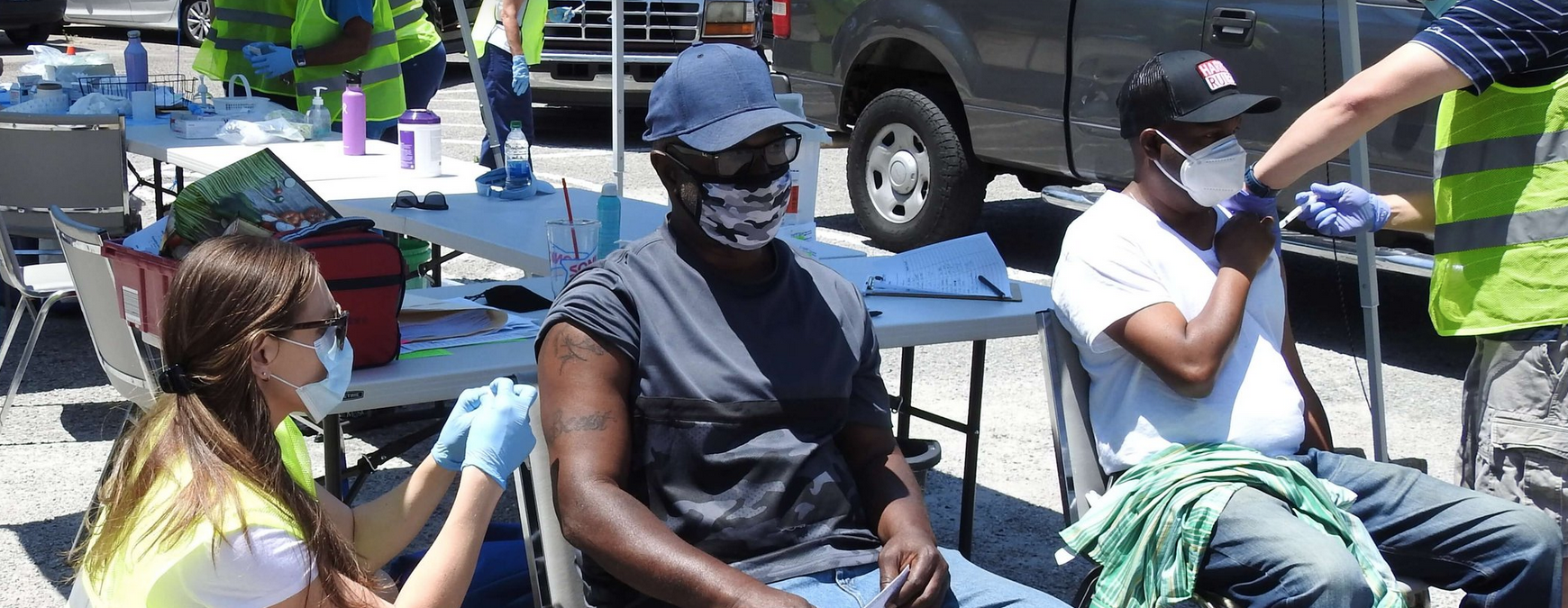 People receiving vaccines outside during Covid