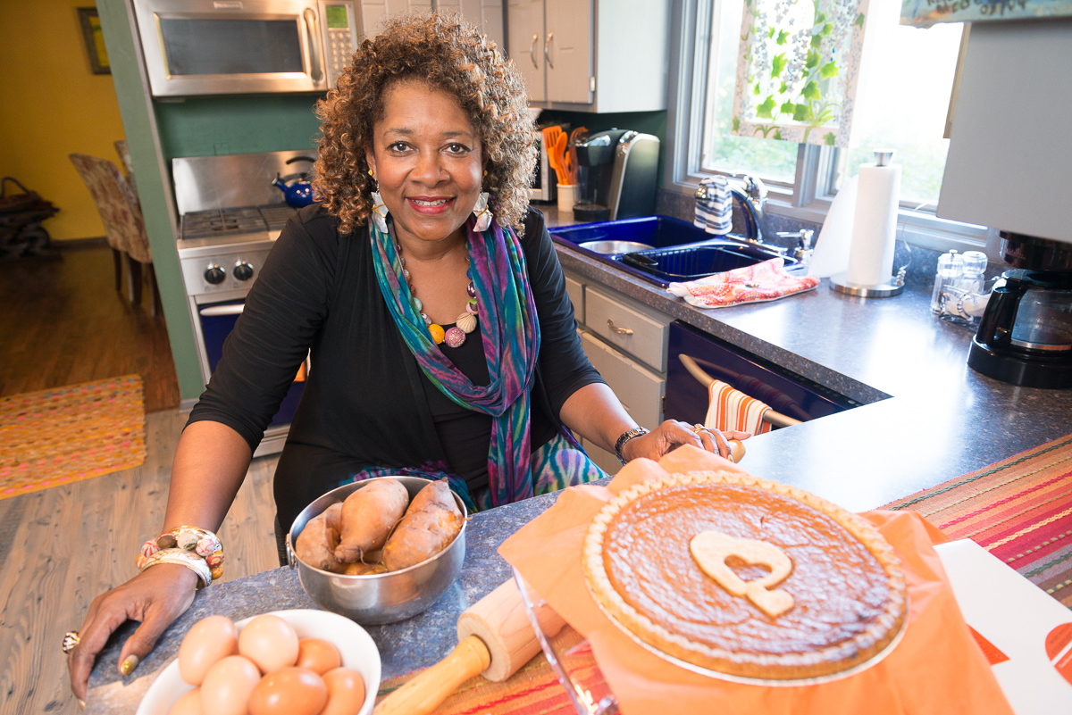 Rose McGee in her kitchen with a pie and baking ingredients.