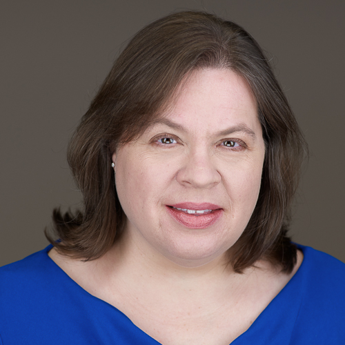 Headshot of grad student Teri Heard-Ralbovsky wearing a bright blue top