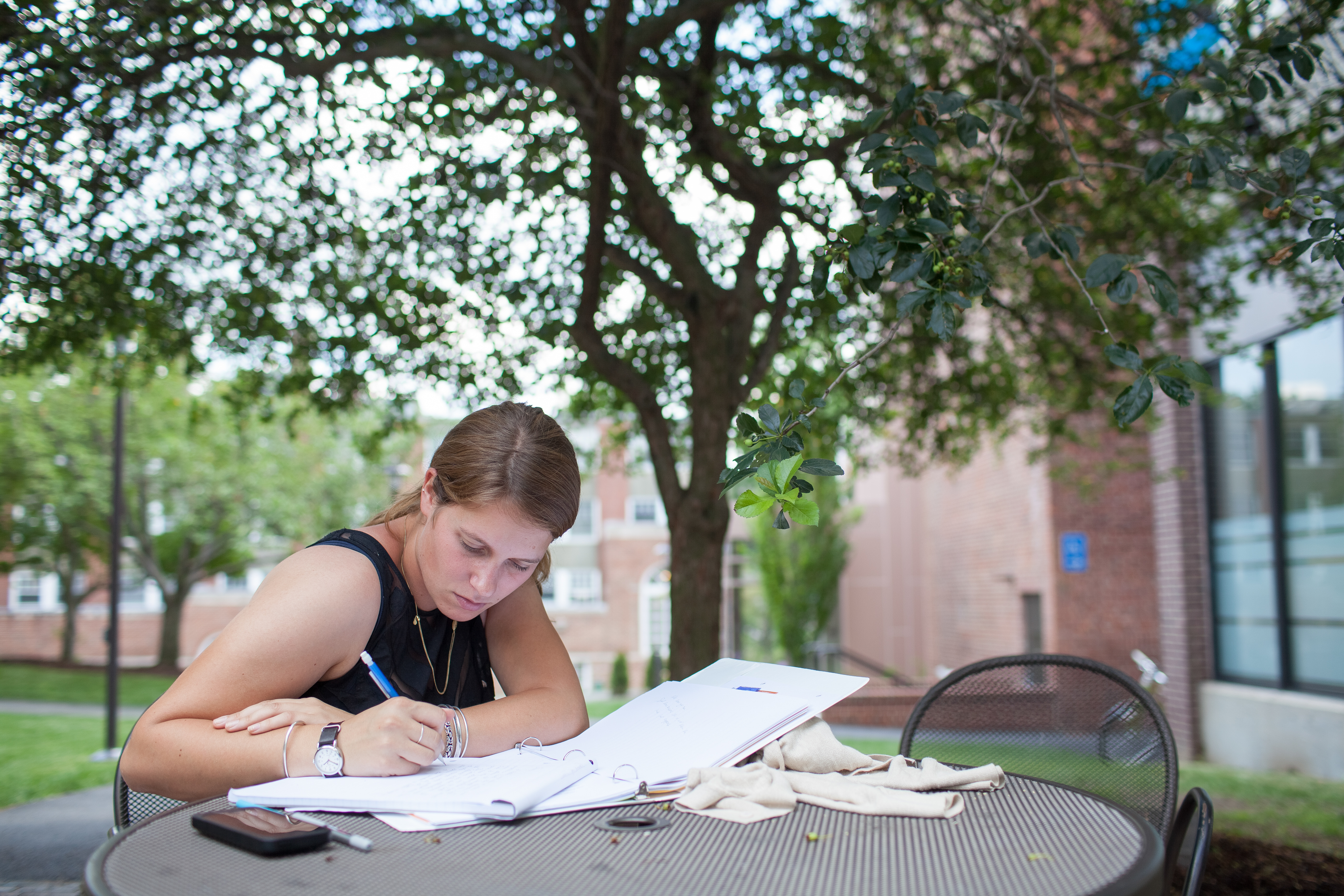 female writing outside