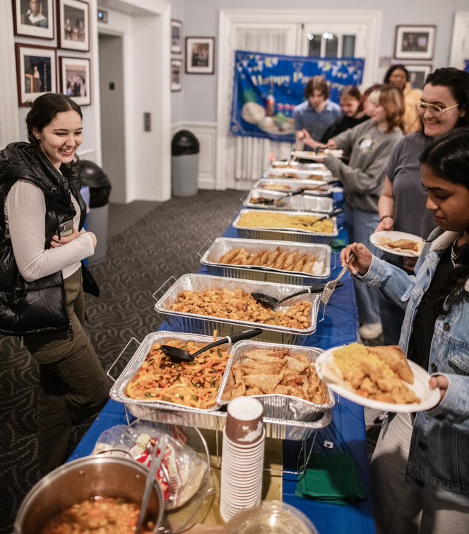 Students gathered around the Passover/Ramadan chow line