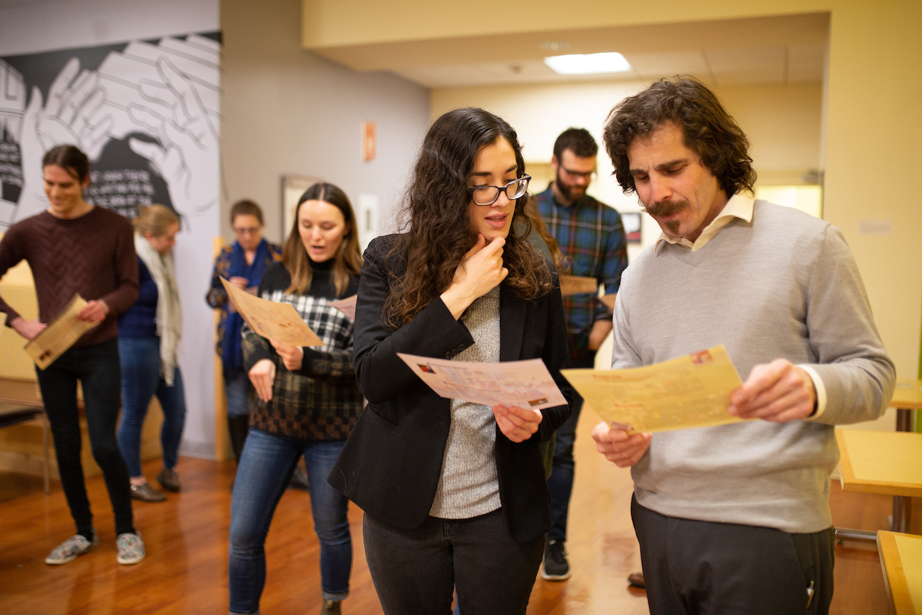 Group of people looking at pieces of paper