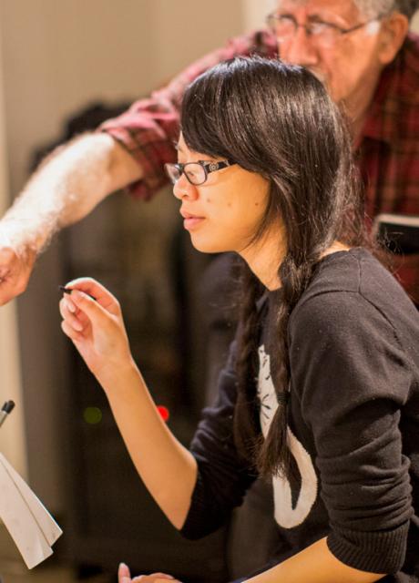 student and instructor in drawing class