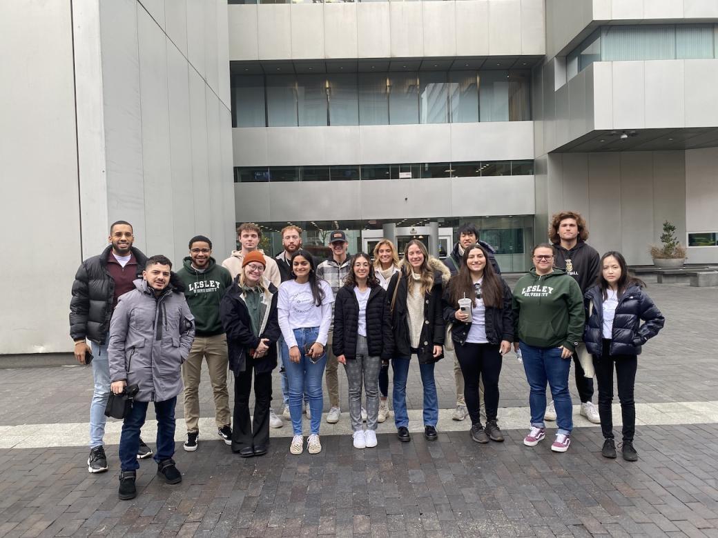 group of students standing in front of the Boston federal reserve