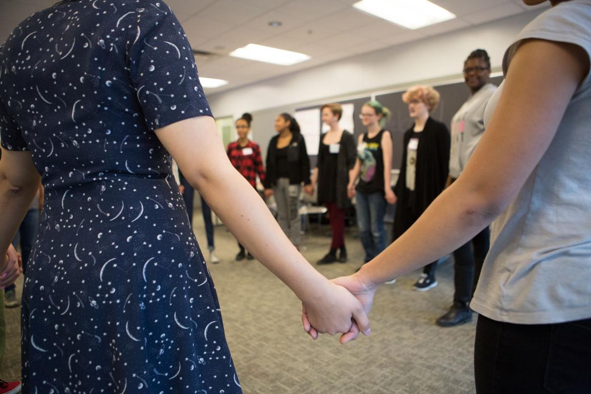 Girls stand in a circle