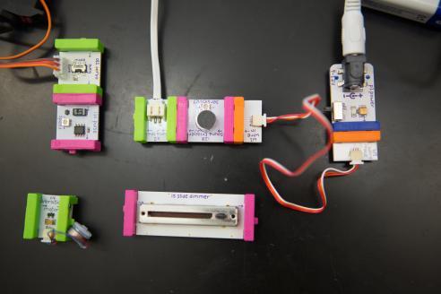 An array of simple circuit boards arrayed on a table in the STEAM Learning Lab at Lesley