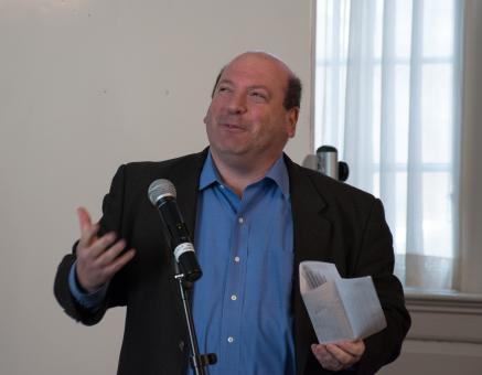 President Jeff Weiss speaks at the microphone.