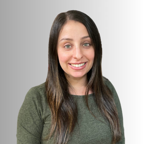 Photo of staff member Sam Sklar smiling with white background