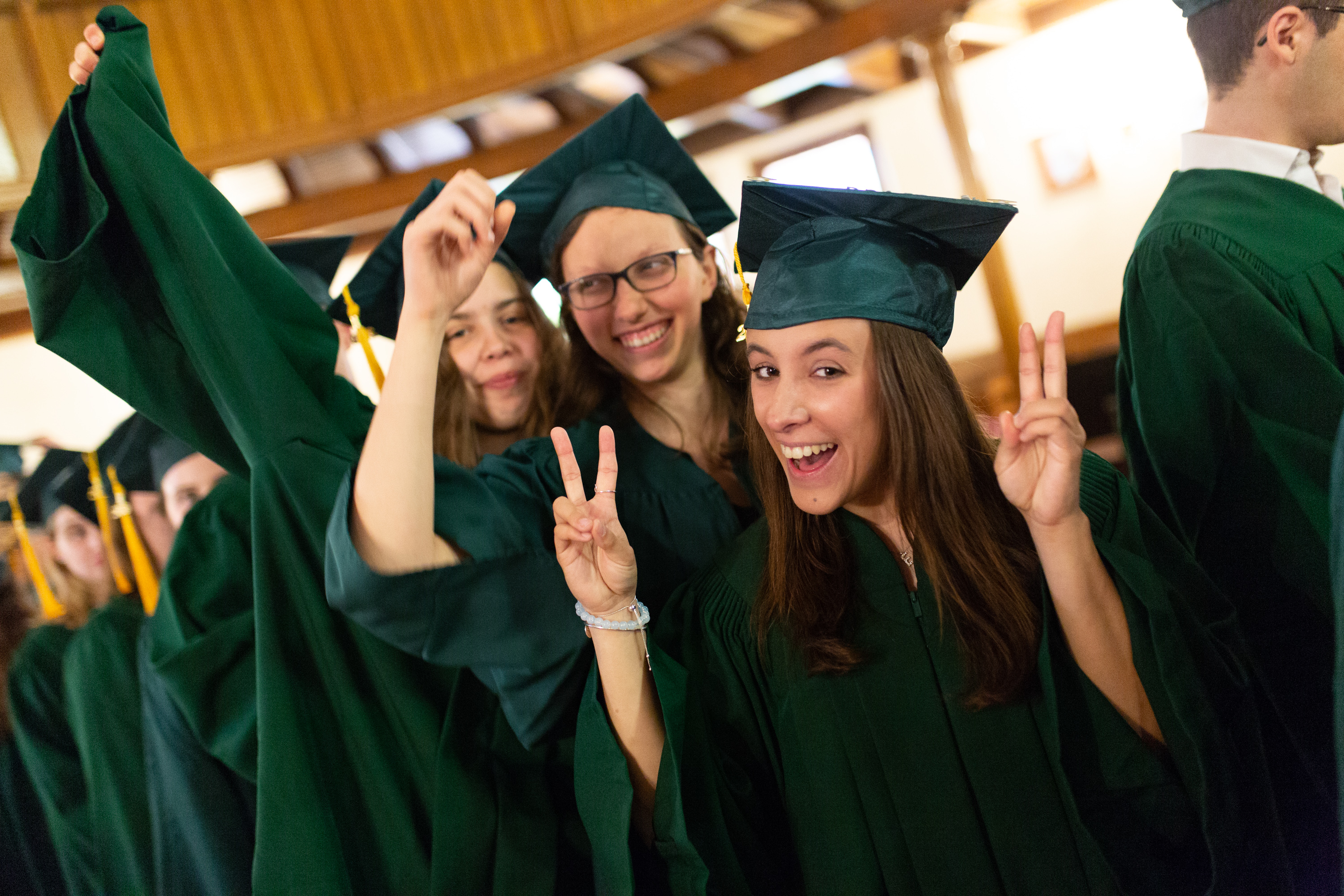 Graduates smile for the camera.